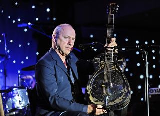 National treasure: Mark Knopfler with his National Style O