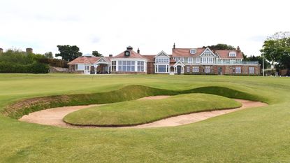 A view of the 18th green at Muirfield with the clubhouse in the background
