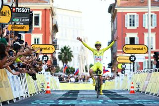 Slovenian Tadej Pogacar of UAE Team Emirates celebrates as he crosses the finish line to win stage 21, the final stage of the 2024 Tour de France cycling race, an individual time trial from Monaco to Nice, France (33,7 km) on Sunday 21 July 2024. The 111th edition of the Tour de France starts on Saturday 29 June and will finish in Nice, France on 21 July. BELGA PHOTO DAVID PINTENS (Photo by DAVID PINTENS / BELGA MAG / Belga via AFP)