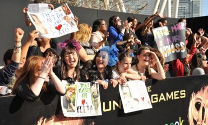 Girls cheer at the premiere of "The Hunger Games": While the books drew plenty of male fans, only 48 percent of boys are reportedly interested in seeing the movie.