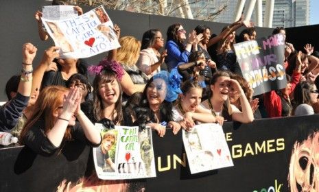 Girls cheer at the premiere of &amp;quot;The Hunger Games&amp;quot;: While the books drew plenty of male fans, only 48 percent of boys are reportedly interested in seeing the movie.