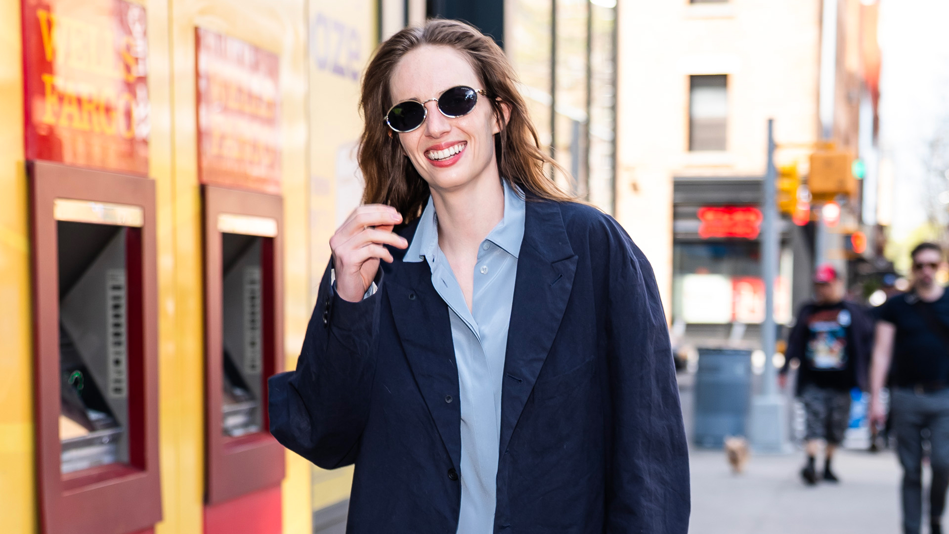 Maya Hawke walking in Manhattan with a belted bag