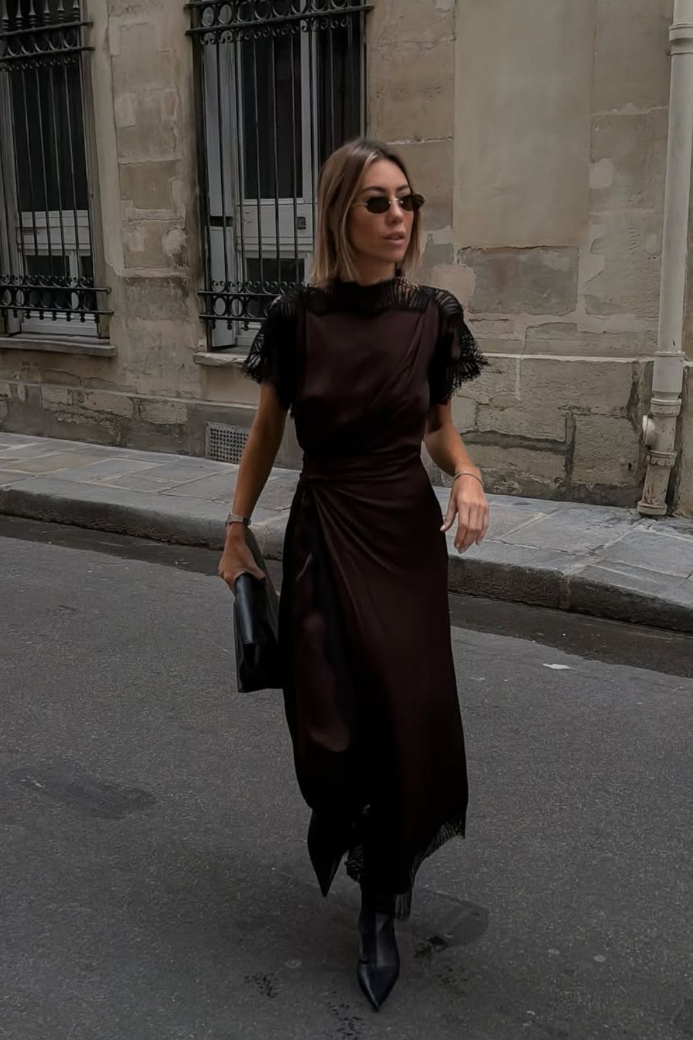 @hannahlewisstylist Black Boot Outfits wearing a chocolate brown lace trim midi dress with black pointed boots