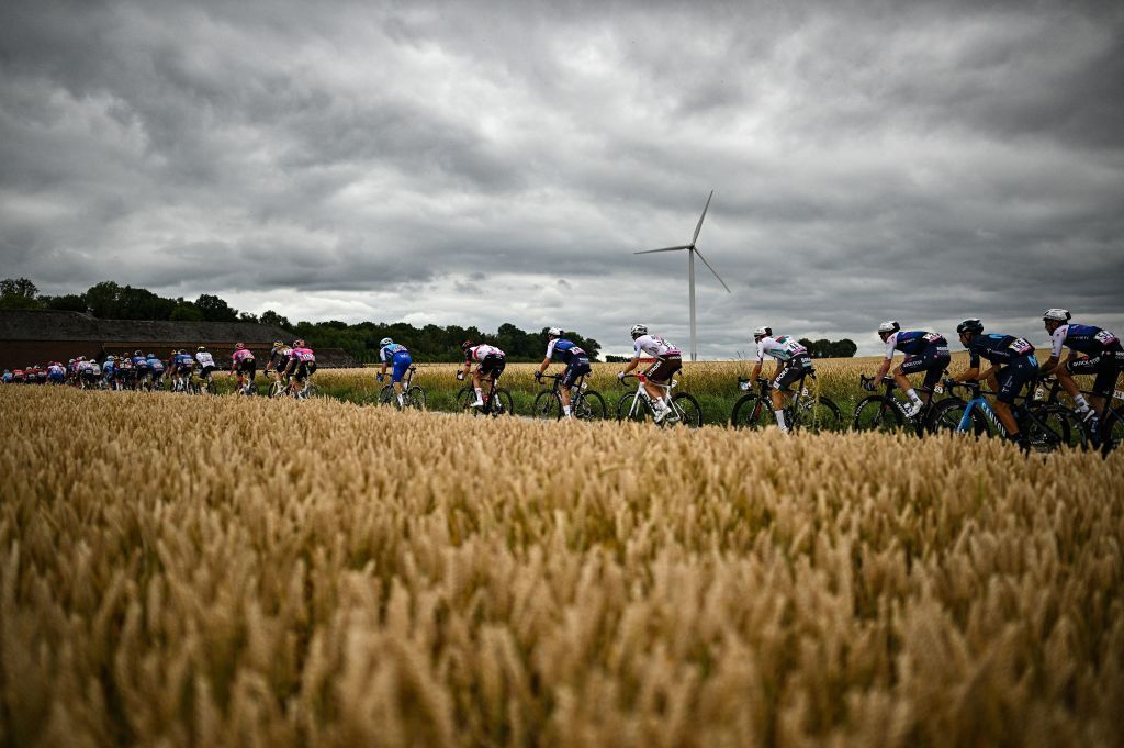 TOPSHOT The pack of riders cycles during the 6th stage of the 109th edition of the Tour de France cycling race 2199 km between Binche in Belgium and Longwy in northern France on July 7 2022 Photo by Marco BERTORELLO AFP Photo by MARCO BERTORELLOAFP via Getty Images