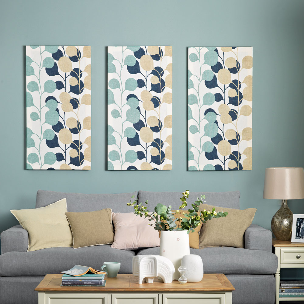 living area with artwork and grey sofa