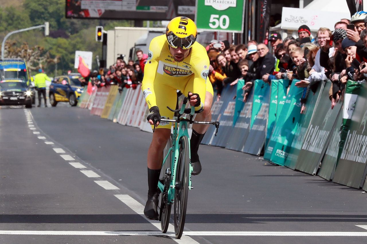 Roglic crossing the line to take the overall win