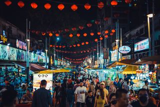 Jalan Alor street at night with throngs of visitors there to eat delicious food