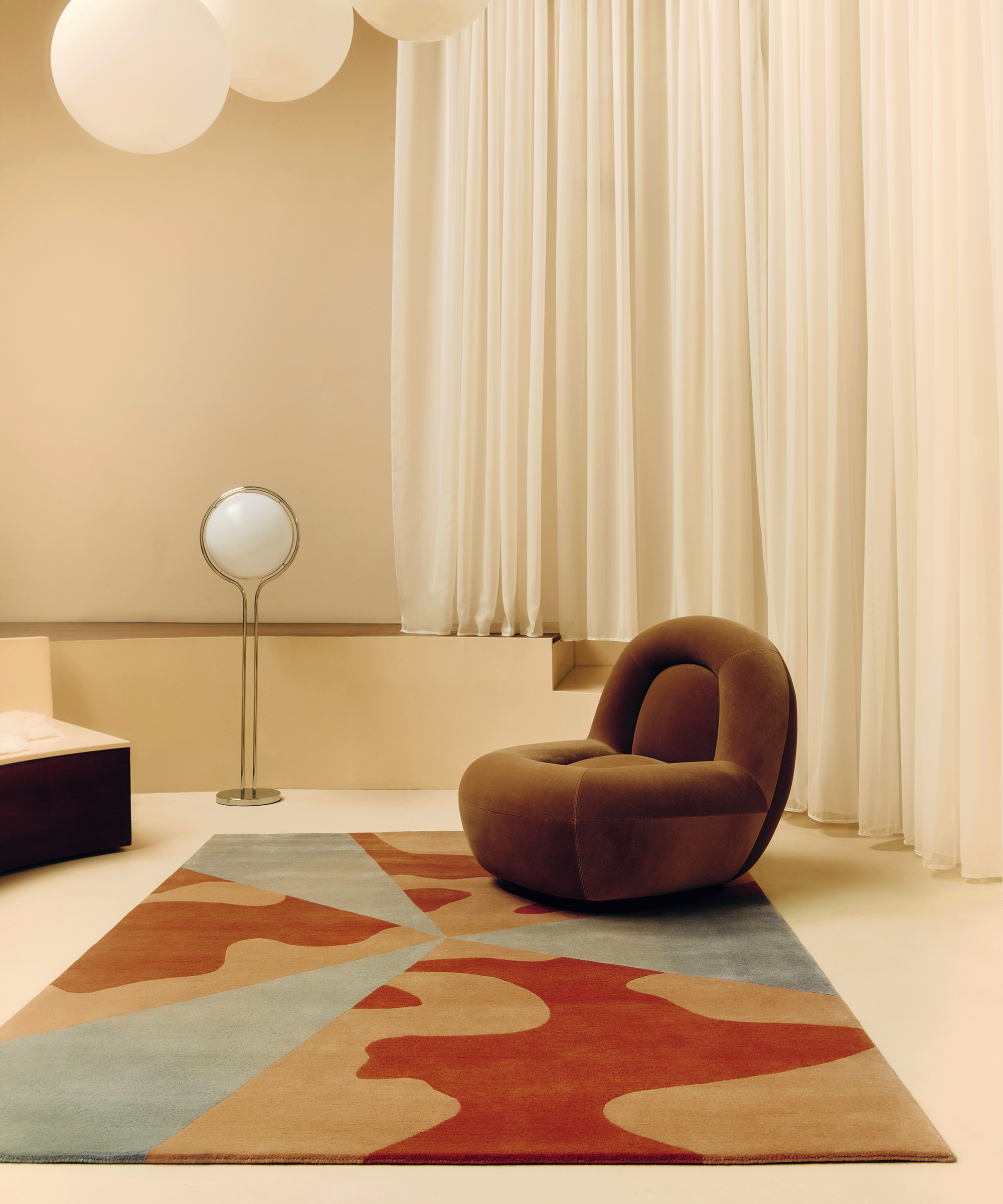 large room with graphic rug in it