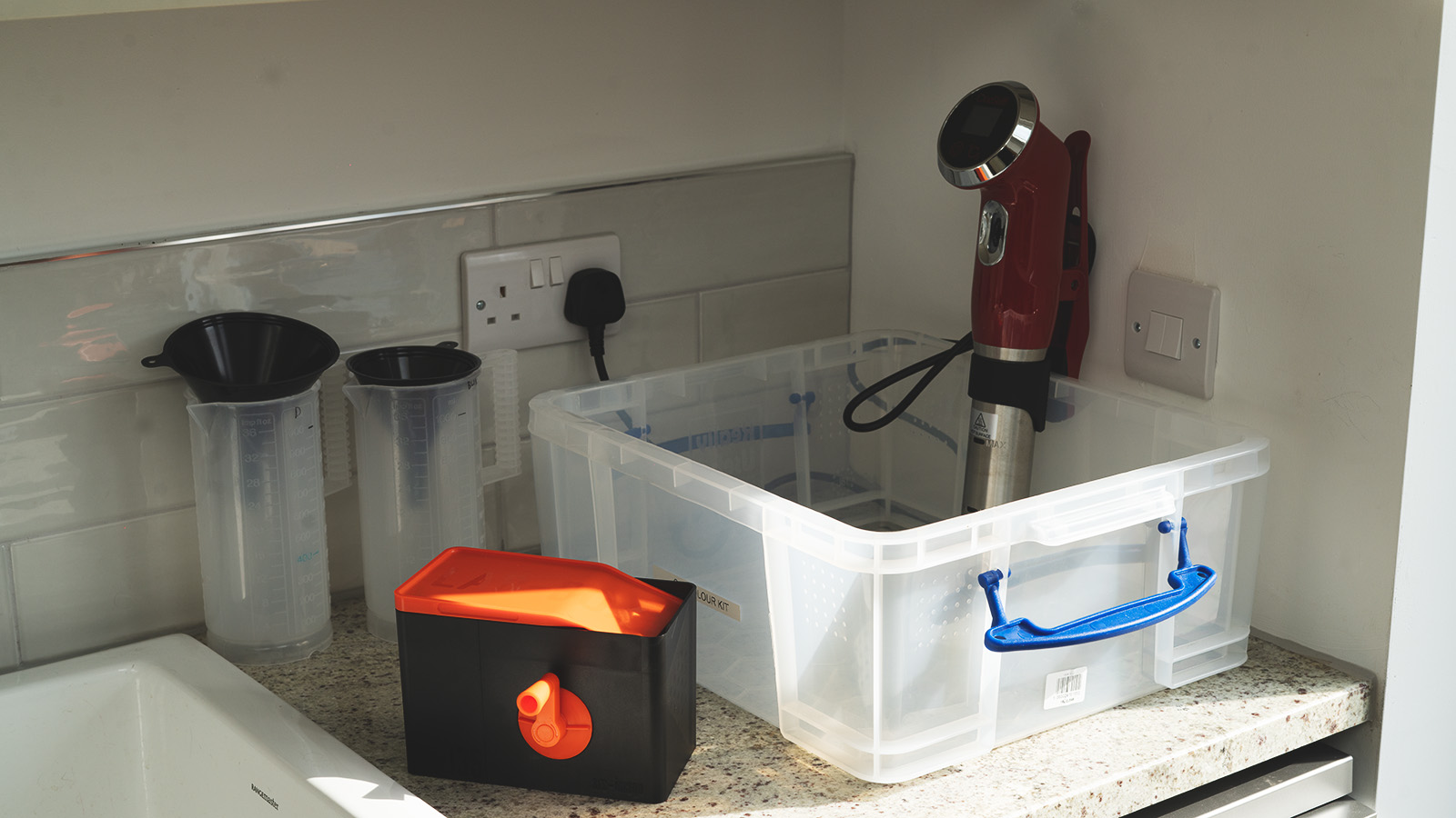 A selection of home film developing equipment and chemicals.