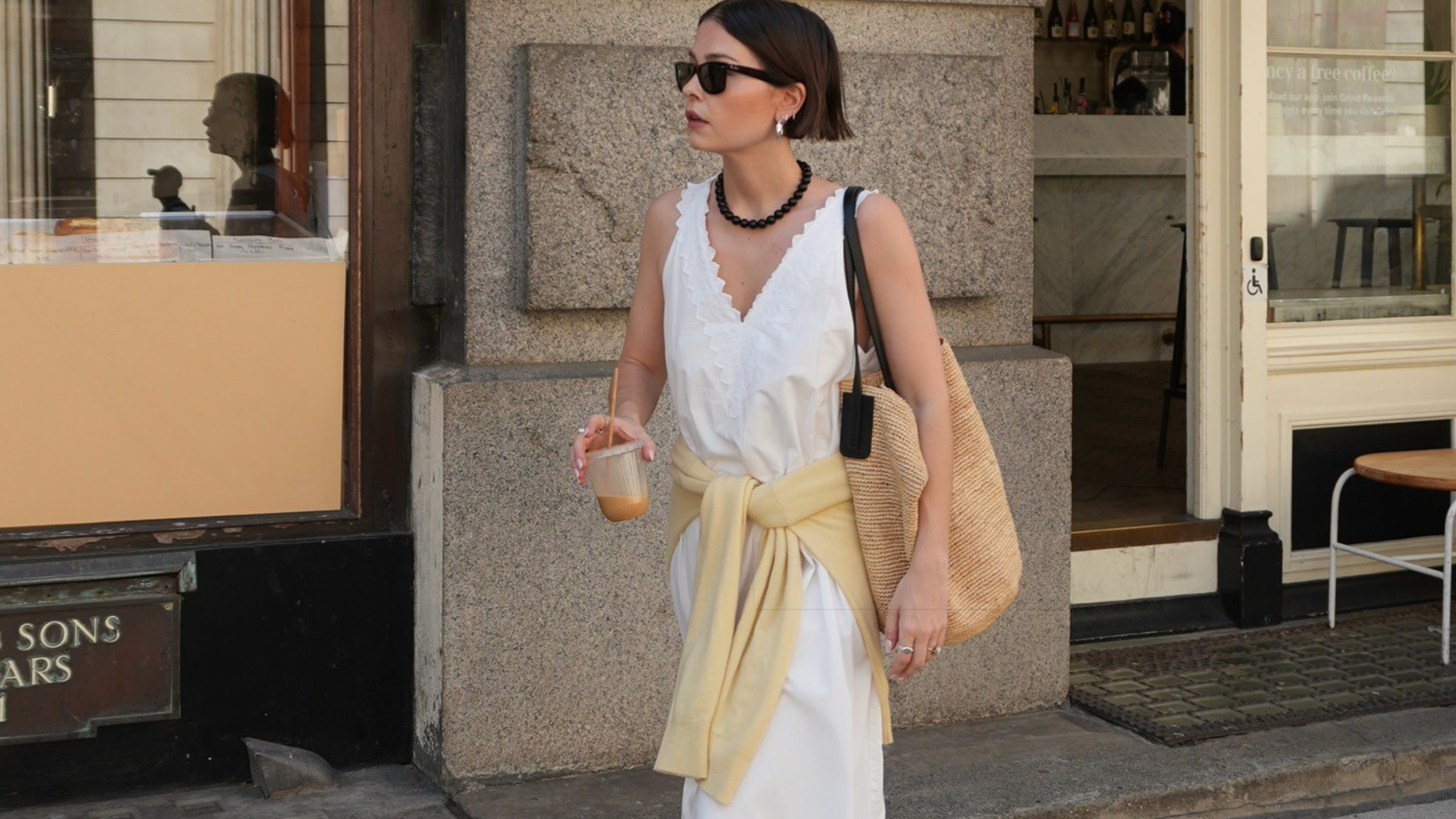 woman wearing white dress with yellow sweater