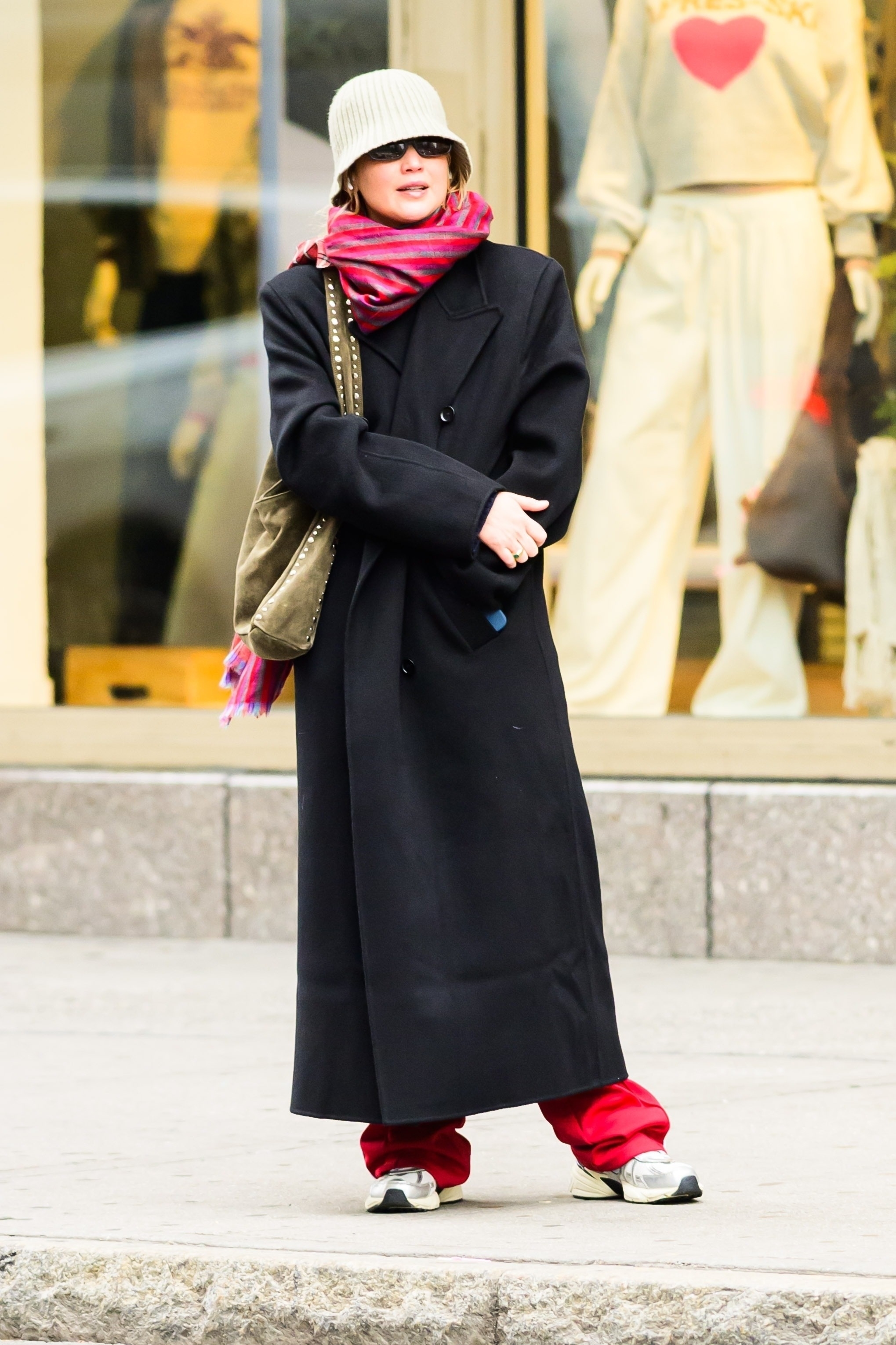 Jennifer Lawrence was spotted in NYC wearing the track pants trend and Nike V2K sneakers