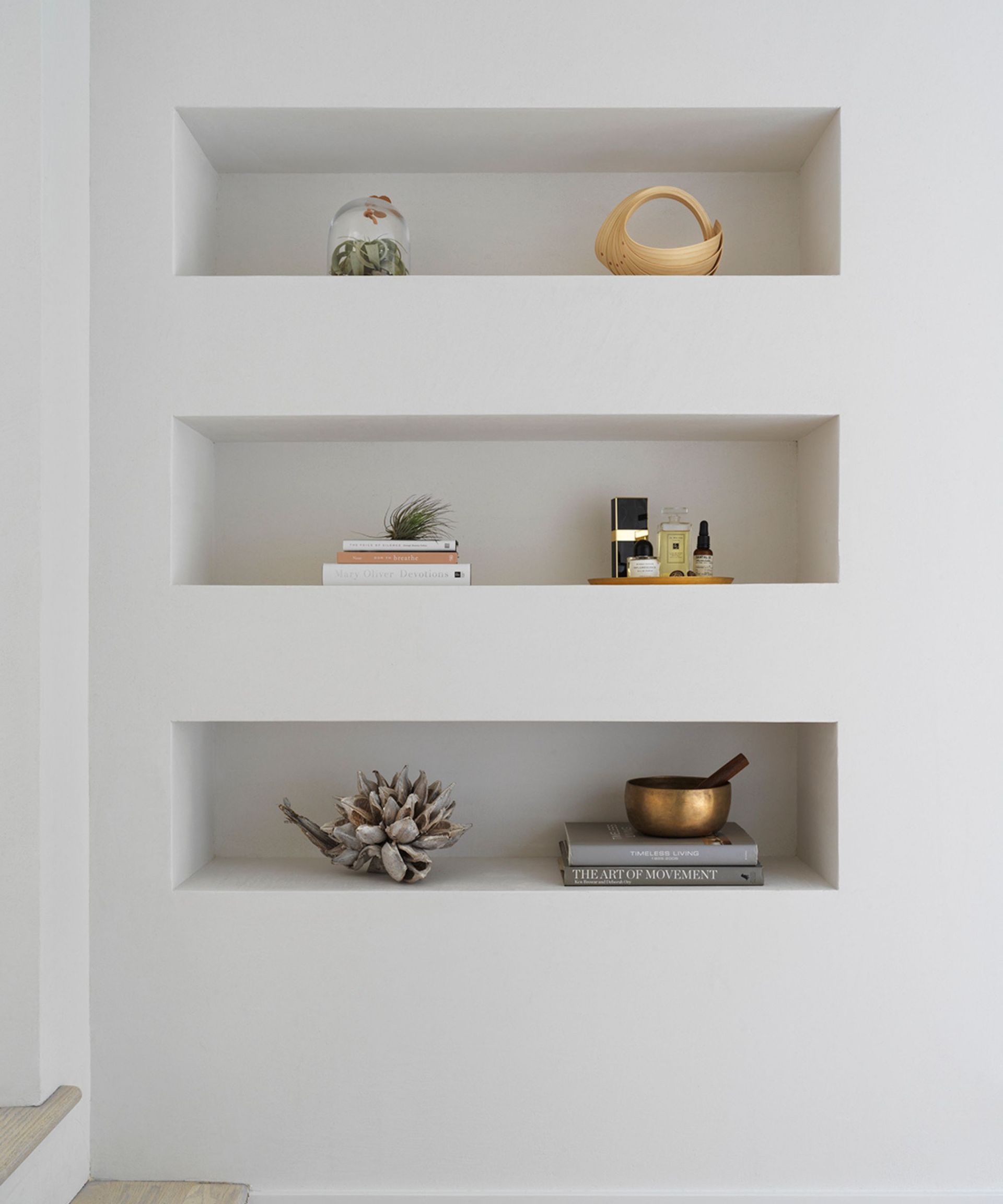 White built in shelves with books and ornaments