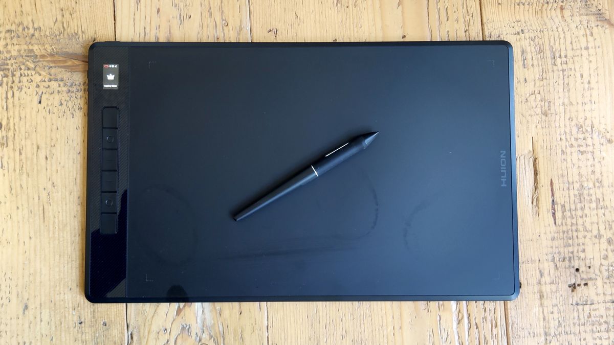 A Huion Inspiroy Giano drawing tablet sitting on a table