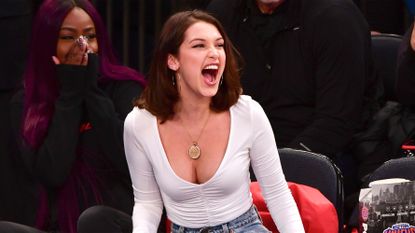 Bella Hadid Knicks Game Outfits and Facial Expressions (Photos)