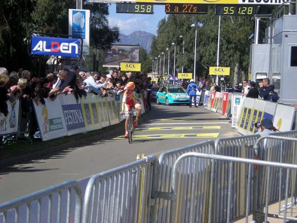 Alberto Contador (Astana) crosses the finish line and checks out his time.