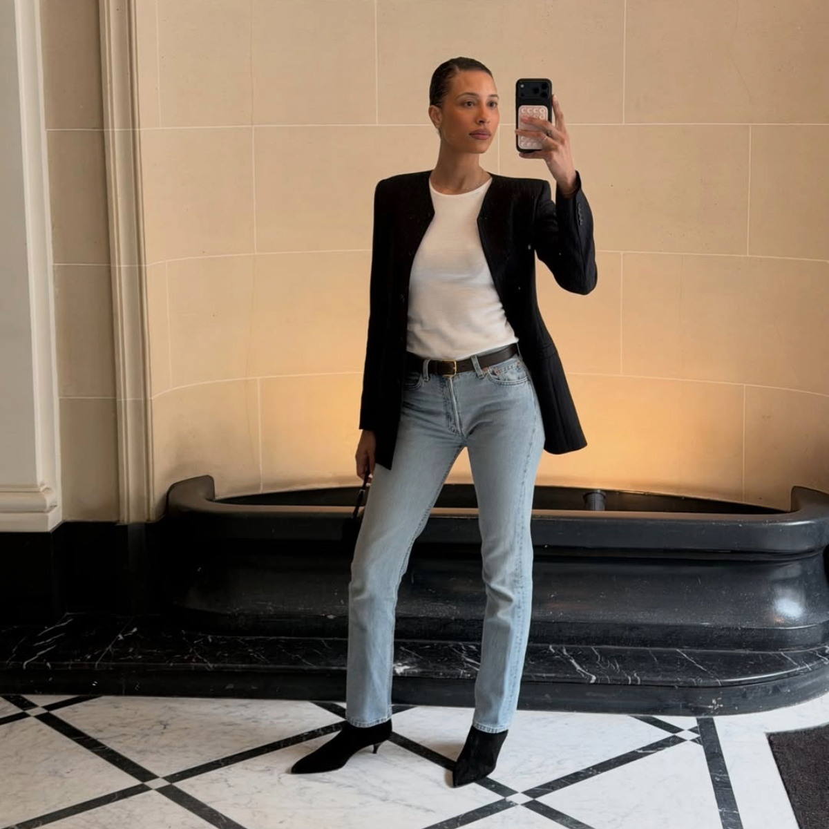 TyLynn Nguyen in light-wash jeans