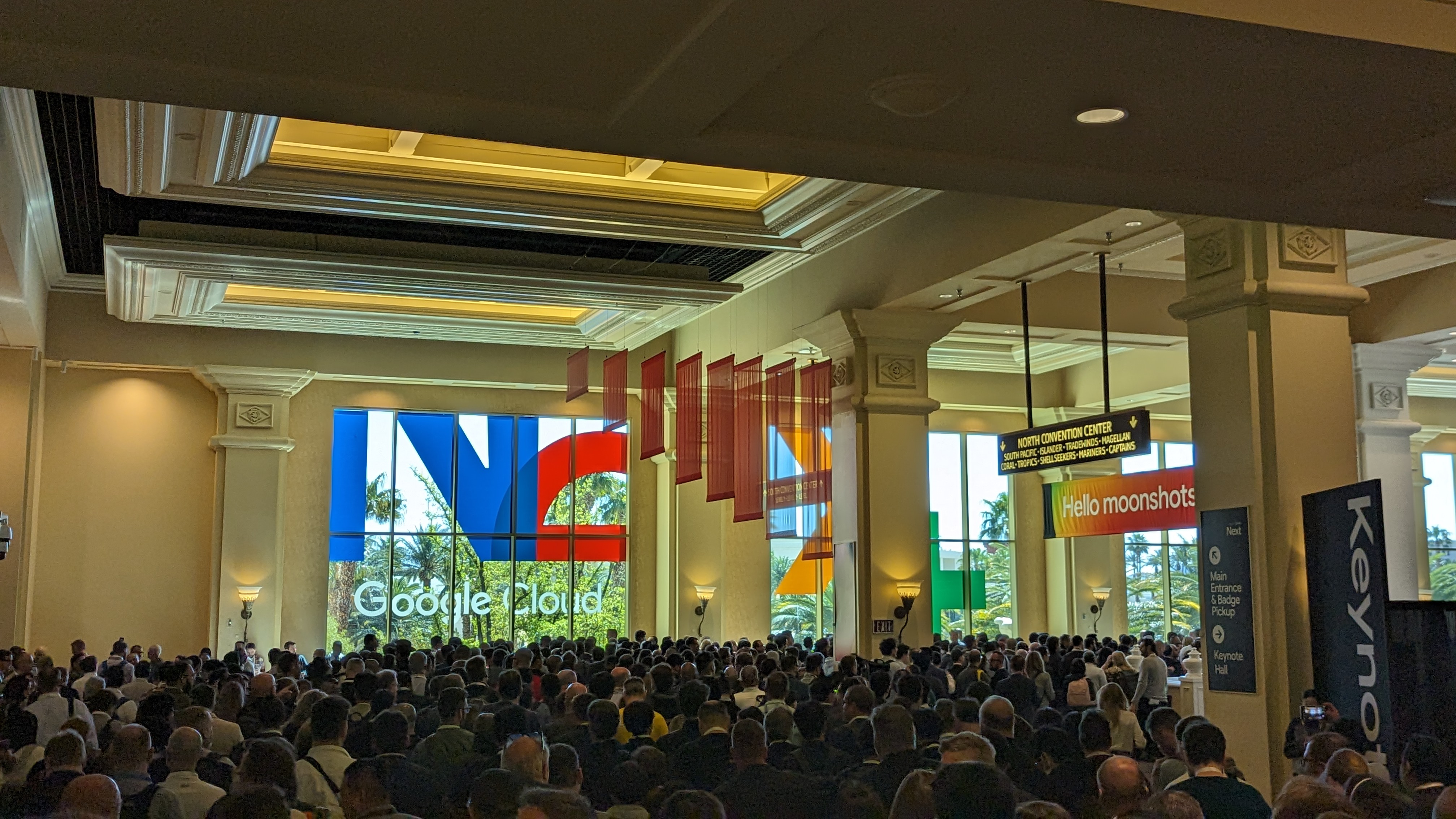 The crowd at Google Cloud Next 2024, walking through a large corridor at the Mandalay Bay, Las Vegas.