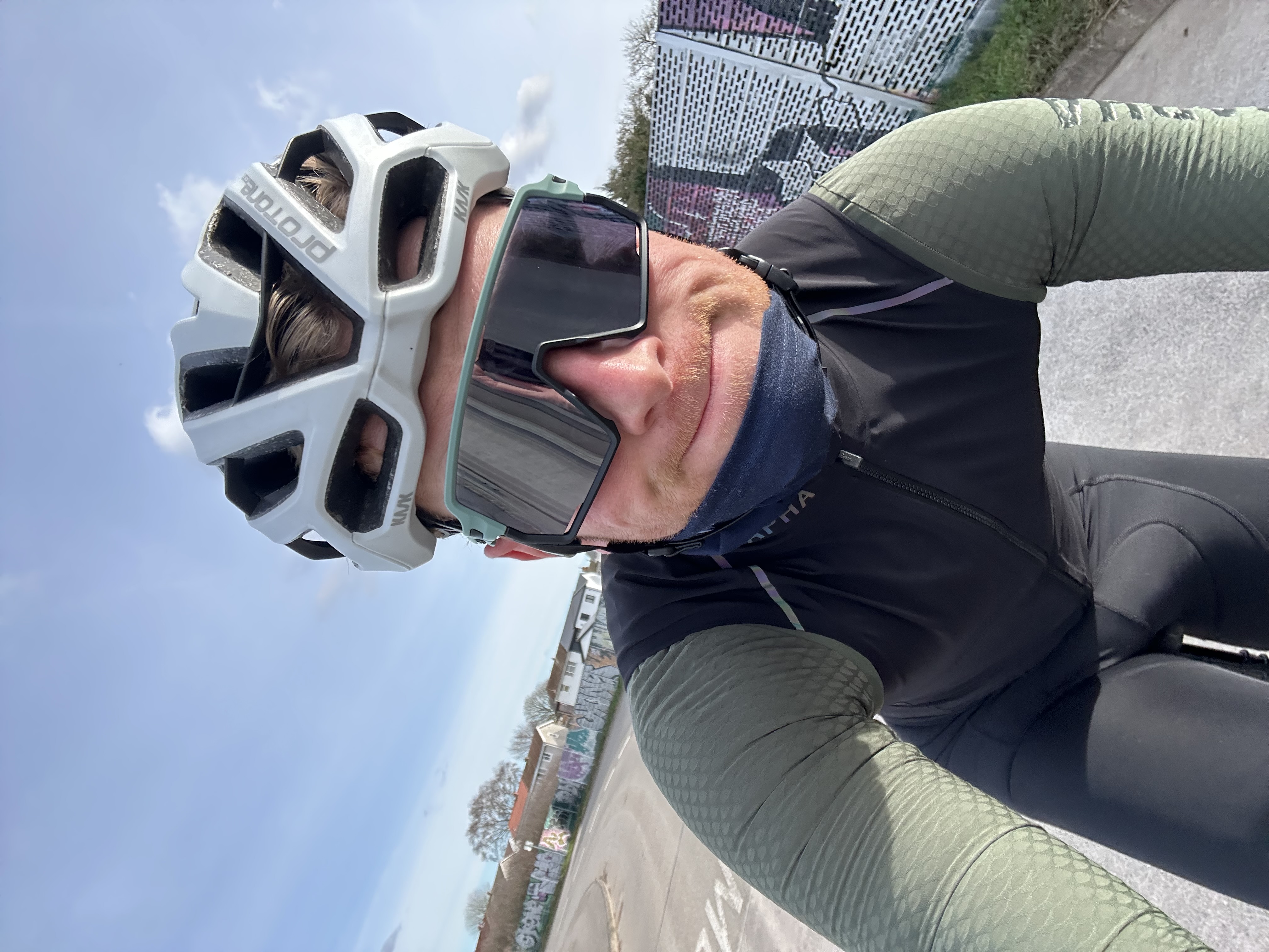 Man cycling wearing sunglasses