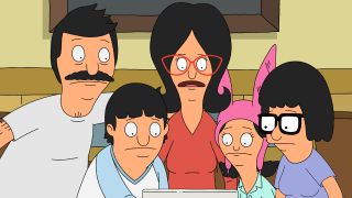 The Belcher family crowds around a computer in Bob's Burgers.