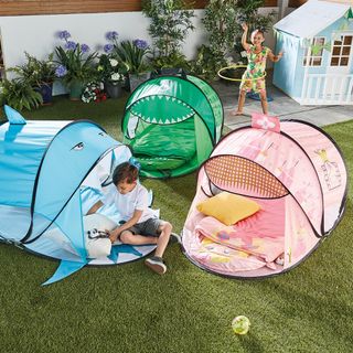 kids playing in garden and tents