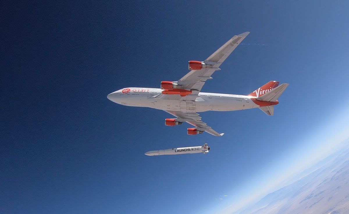 Virgin Orbit’s LauncherOne rocket falls away from its carrier plane during the company’s first-ever drop test on July 10, 2019.