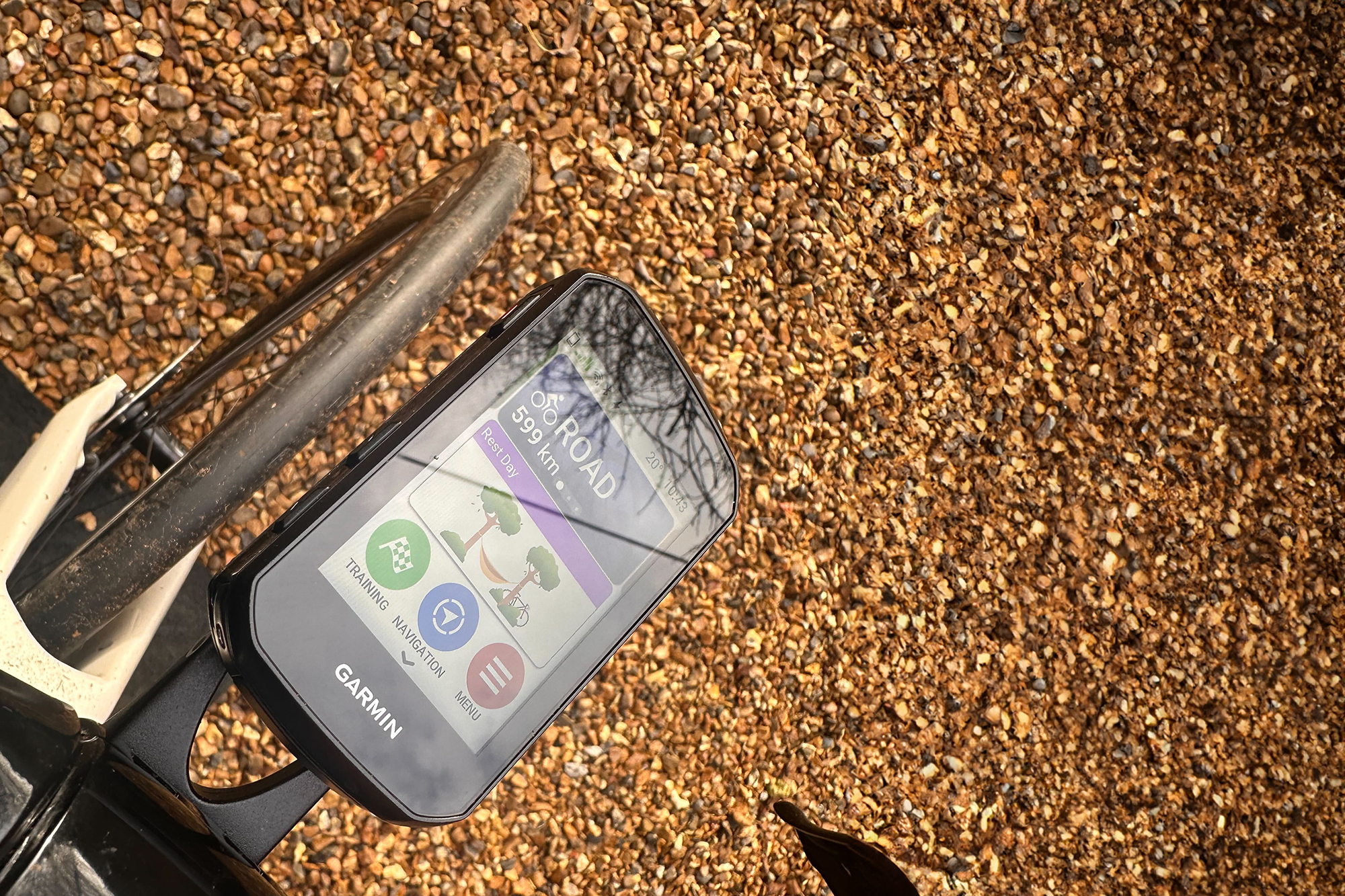 Garmin Edge 850 mount on an outfront mount with the background of a gravel driveway