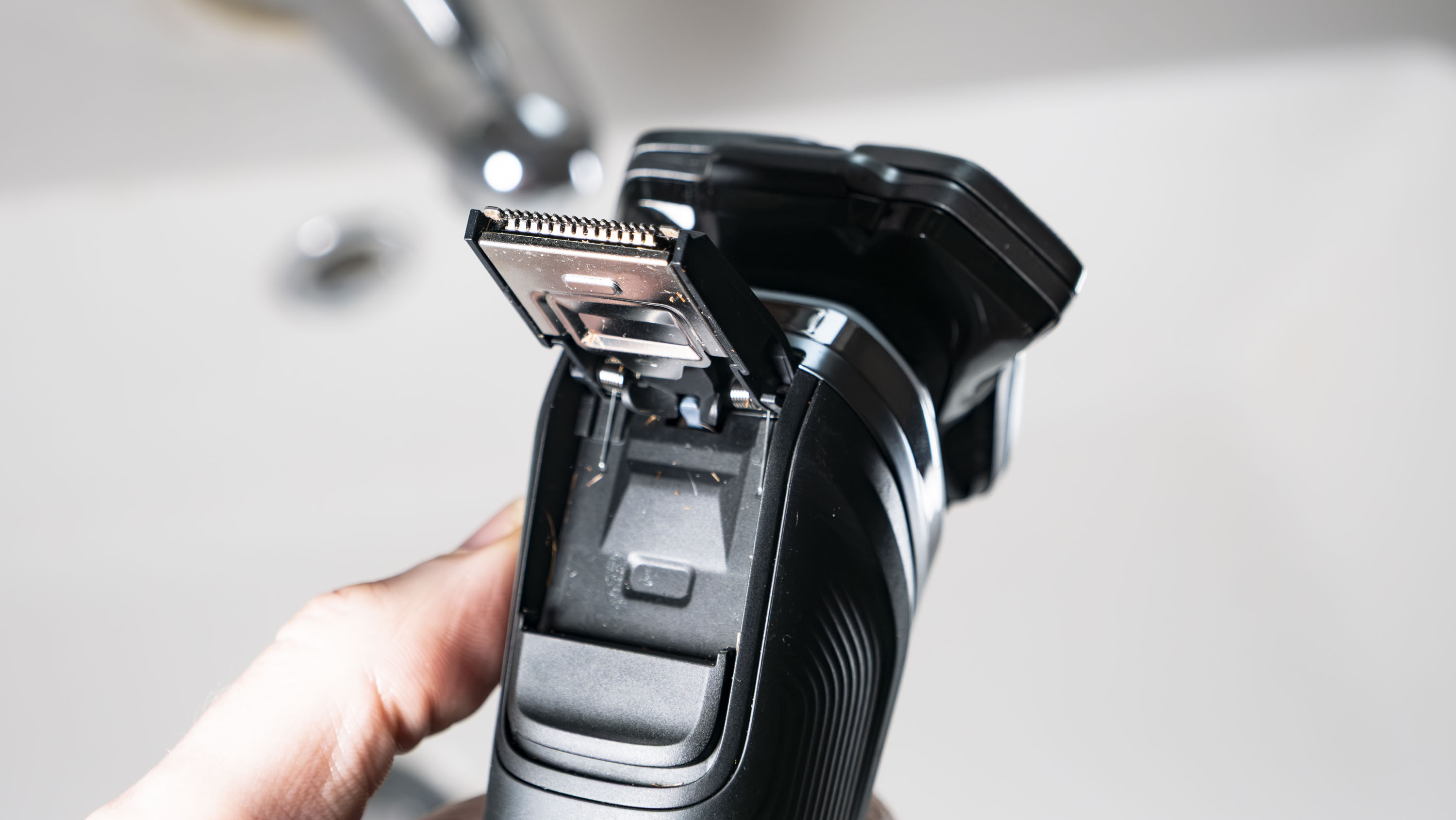 Close up of the Philips i9000 electric razor's pop-up trimmer