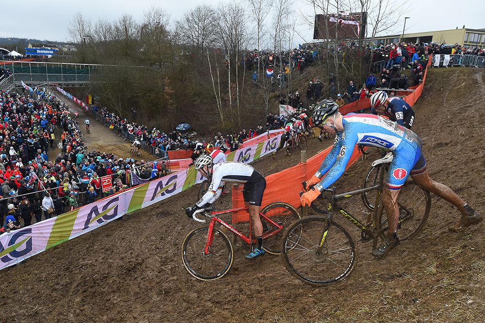 Riders negotiate the slick downhill section