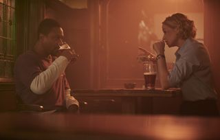 Baz (Nathaniel Martello-White) and Sadie (Niamh Algar) sit in a pub together, drinking and playing with a deck of cards