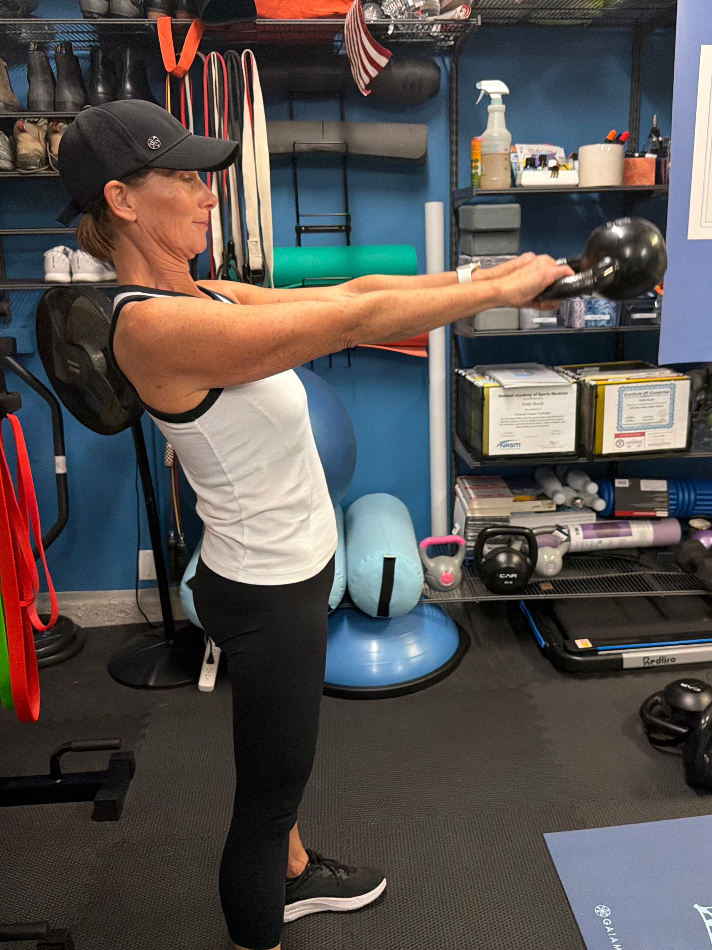 Woman exercises with kettlebell