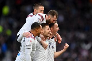 James Collins is celebrating with his teammates after scoring a goal during the Sky Bet League 1 match between Derby County and Peterborough at Pride Park in Derby, England, on January 1, 2024. (Photo by MI News/NurPhoto via Getty Images)