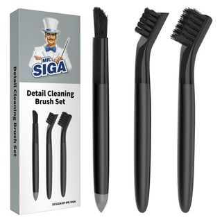 A set of three black detail cleaning brushes next to a grey cardboard box.