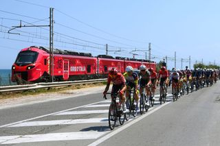 JESI ITALY MAY 17 Thomas De Gendt of Belgium and Team Lotto Soudal leads the peloton close to a train decorated in pink and with the Senza Fine Trophy during the 105th Giro dItalia 2022 Stage 10 a 196km stage from Pescara to Jesi 95m Giro WorldTour on May 17 2022 in Jesi Italy Photo by Tim de WaeleGetty Images