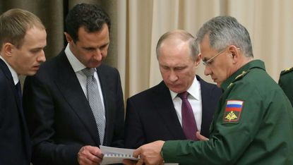 Vladimir Putin discusses military tactics with Syria's Bashar al-Assad