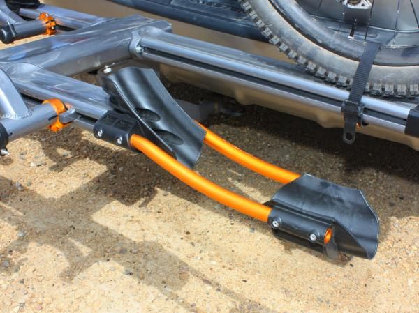 The alloy and plastic front wheel cradles handle both downhill and road-width tires equally well. Don't get too attached to the fancy anodized finish, though - ours faded badly after just a few months of use