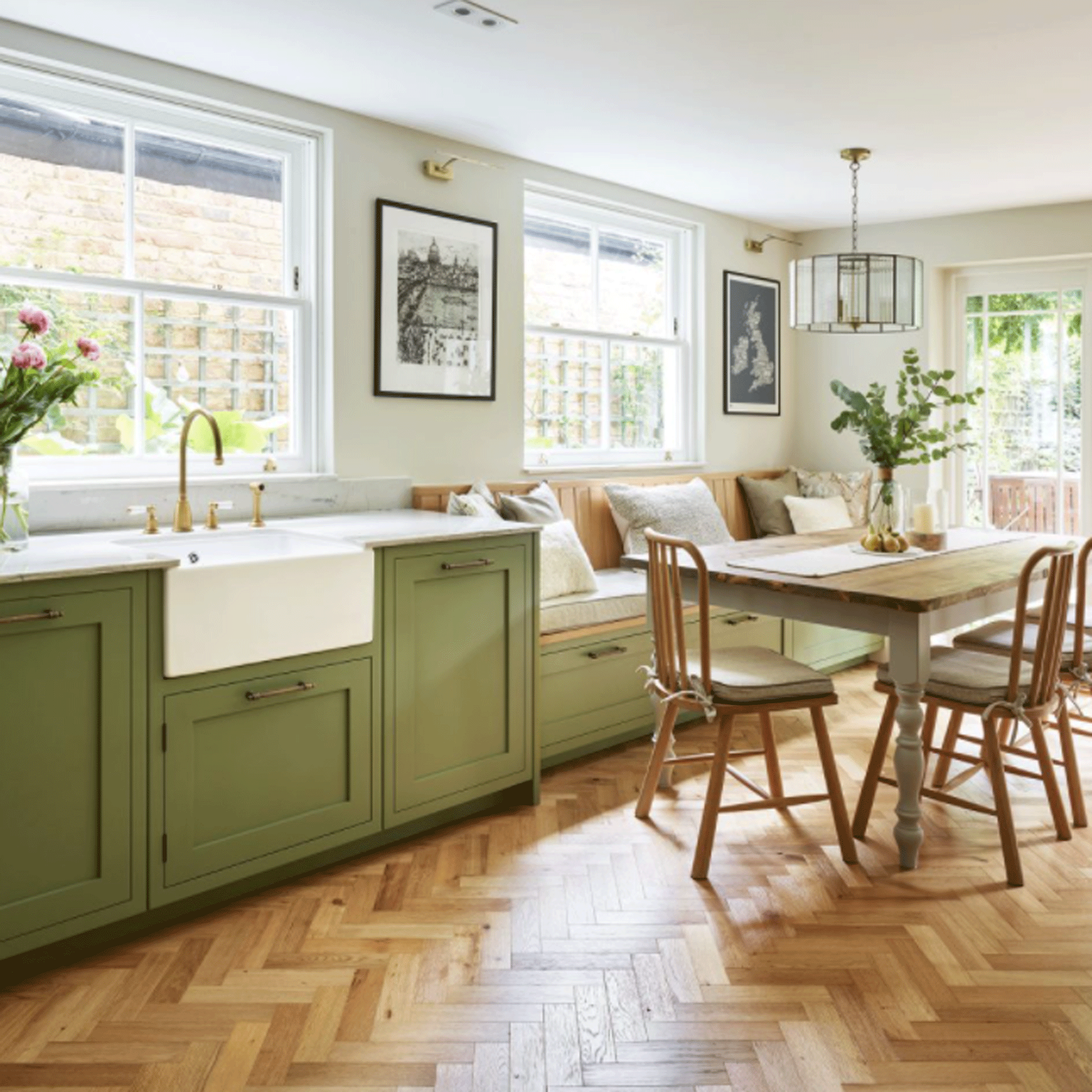 Green kitchen with banquette seating