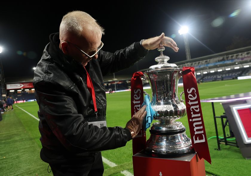 LUTON, ENGLAND - OCTOBER 31: The Emirates FA Cup trophy gets a polish before the Emirates FA Cup First Round match between Luton Town and Forest Green Rovers on October 31, 2025 in Luton, England. (Photo by Eddie Keogh/Getty Images)