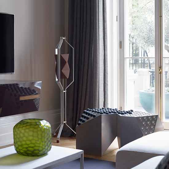 seating area with slide window and curtains on window