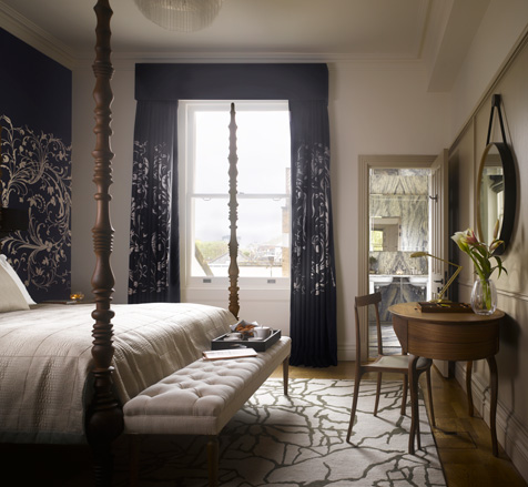 Four poster bed in hotel room