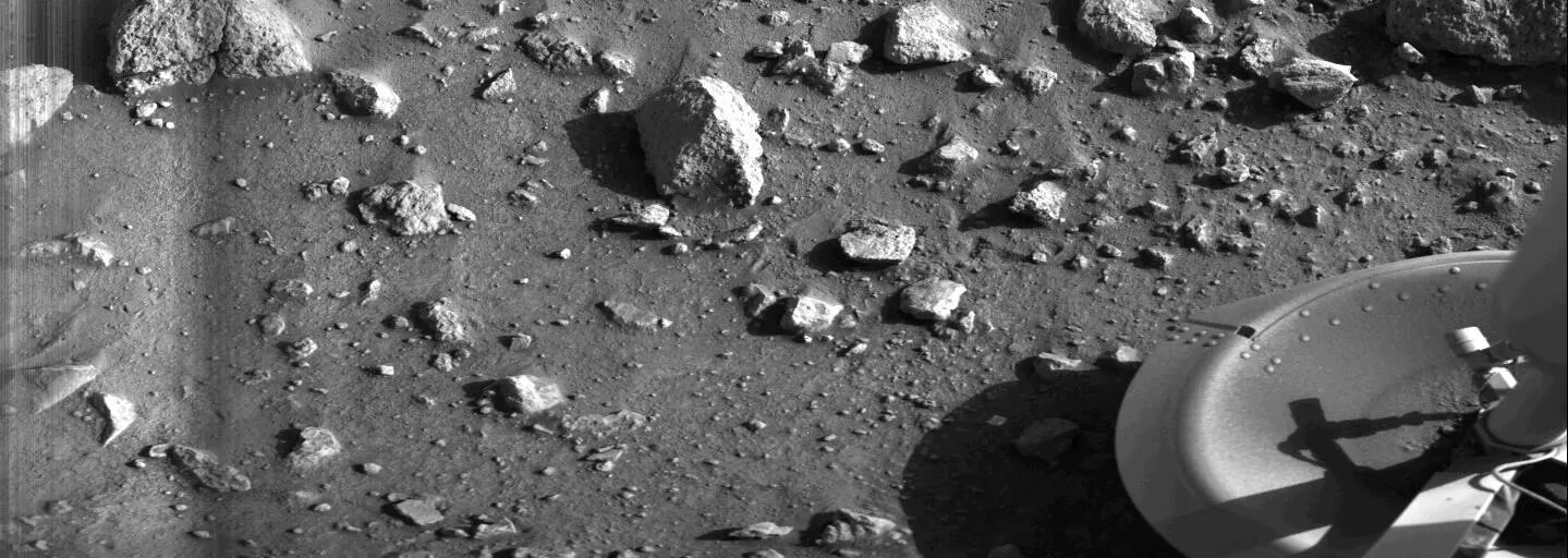 Spacecraft foot on rocky surface.