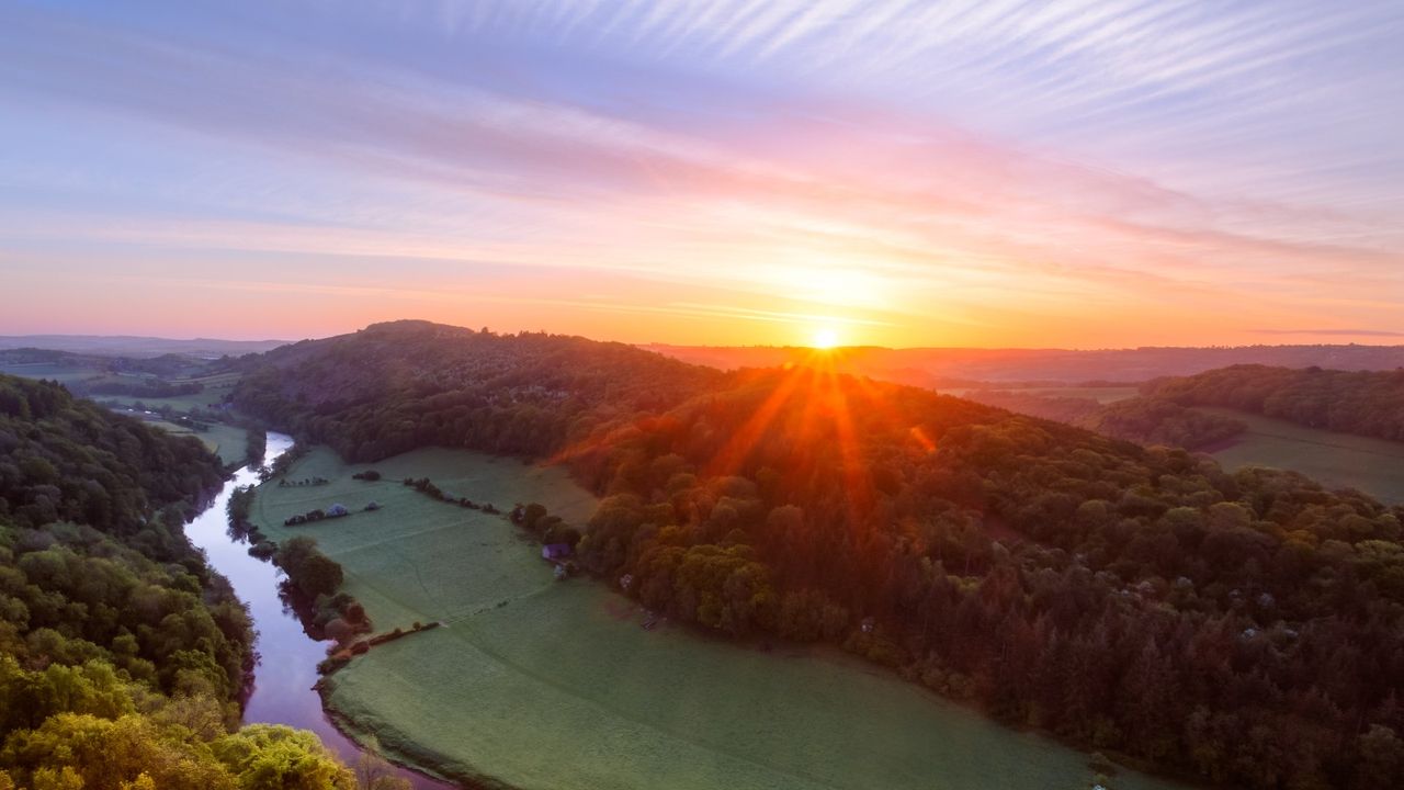 when do the mornings get lighter? Sunrise over the countryside