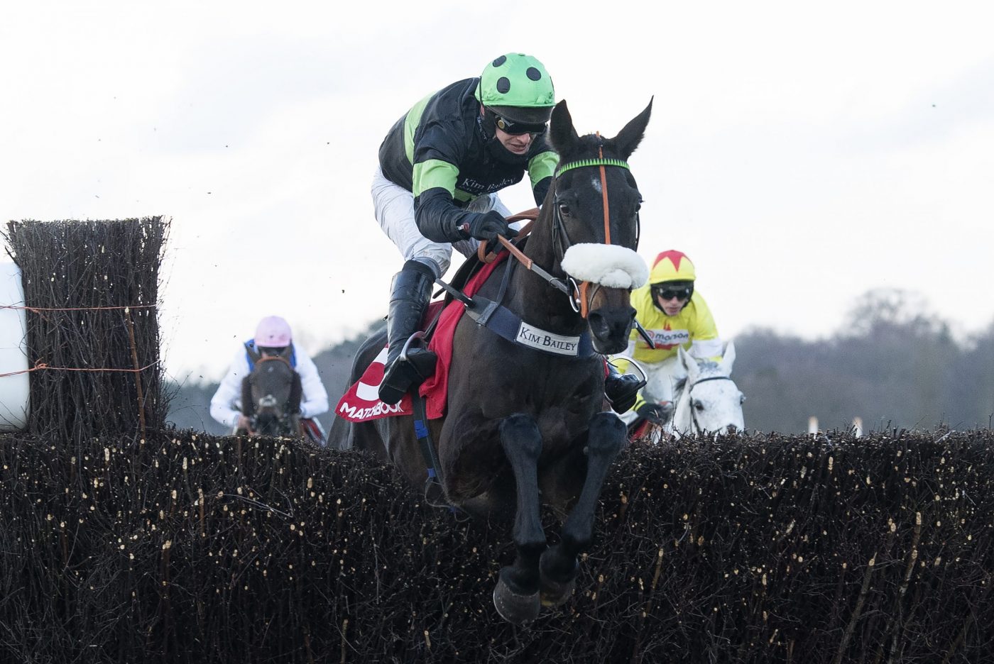 First Flow (David Bass) leads over the last fence and beat Politologue in the Clarence House Chase Ascot 23.1..21 Pic: Edward Whitaker/Racing Post