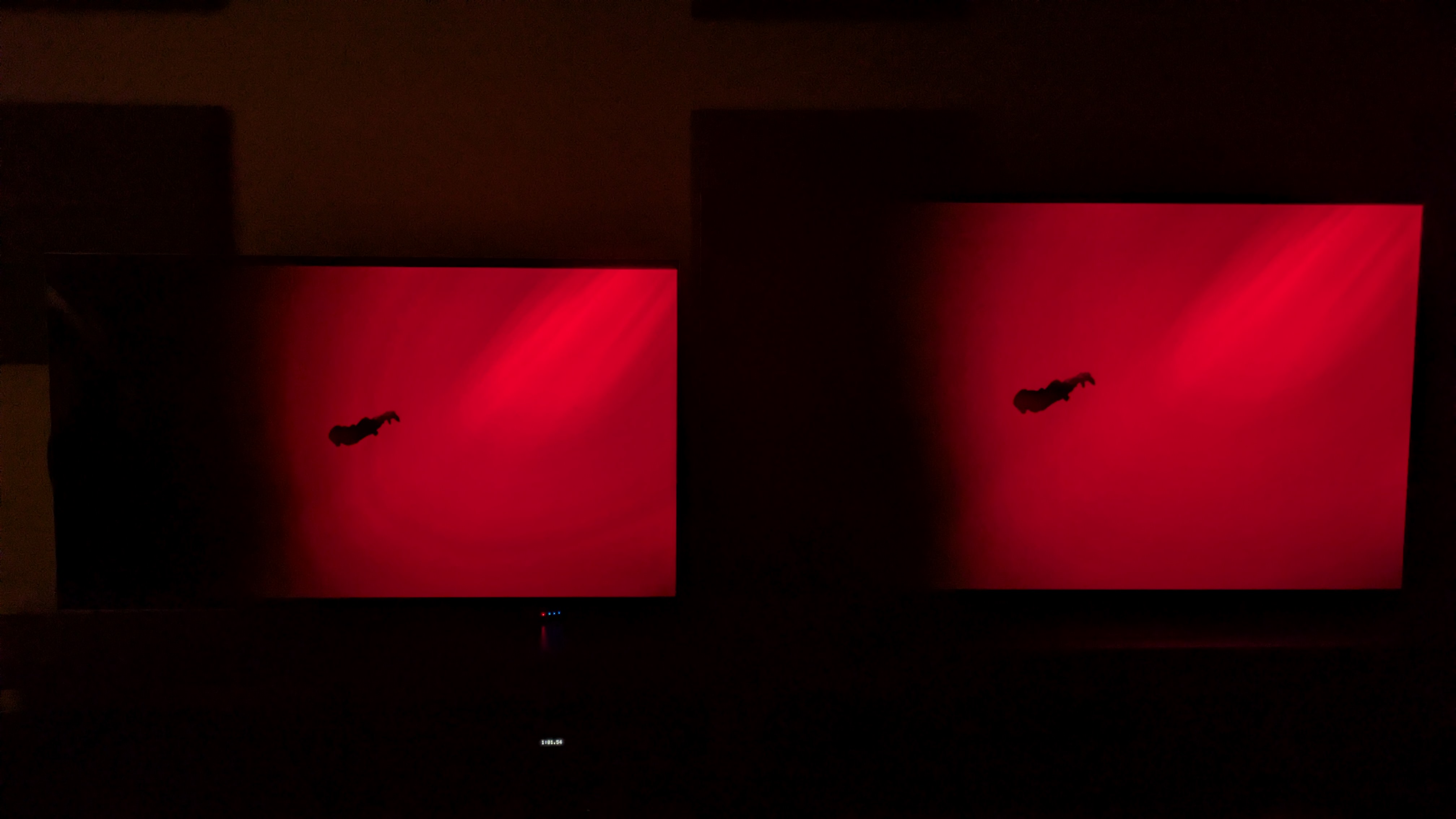 The LG G5 (left) and LG G6 (right) showing a scene from The Green Knight where Gawain swims through a red lake. The G5 shows more color banding than the G6, with rings appearing in the red area.