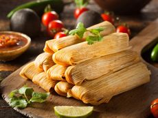 Corn Husks On Table With Other Vegetables