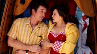 Larry (Miles Teller) and Joan (Elizabeth Olsen) in Eternity.