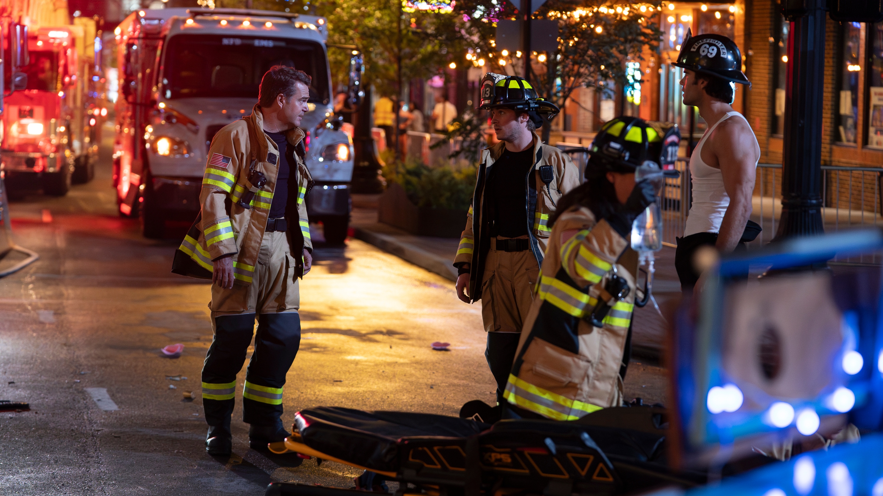 Four firefighters tending to an emergency on the street in 9-1-1: Nashville.