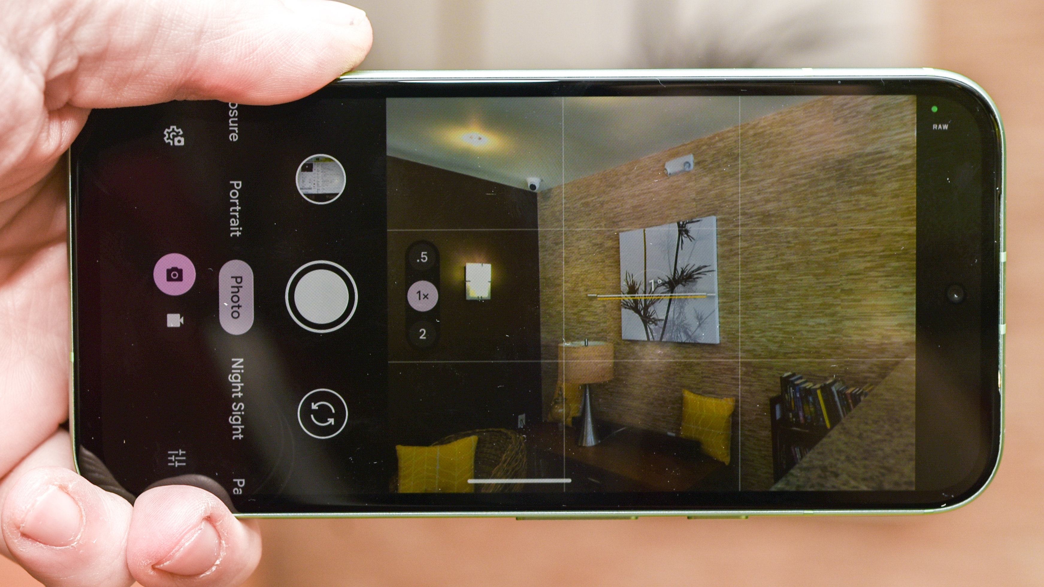 Google Pixel 8a showing camera app focused on living room