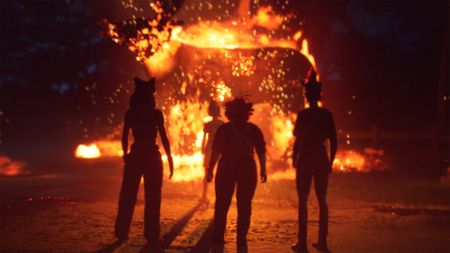 The girls stand in front of a raging fire in Lost Records: Bloom & Rage - Tape 2 while wearing masks