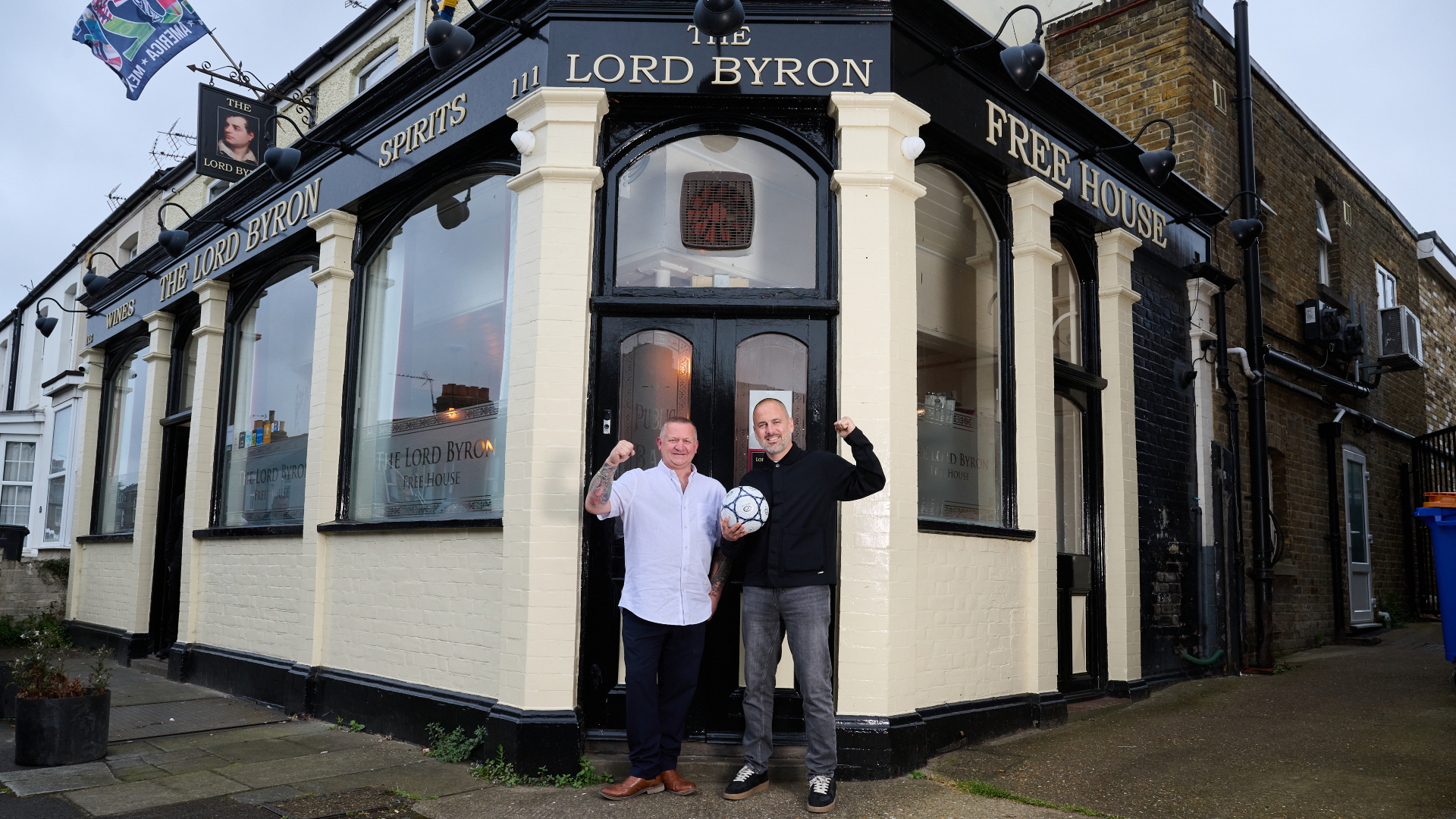Joe Cole standing outside The Lord Byron pub in Margate with the person who runs the pub