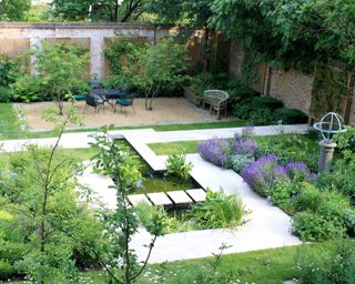 Walled garden design with a garden pond, rill and sundial